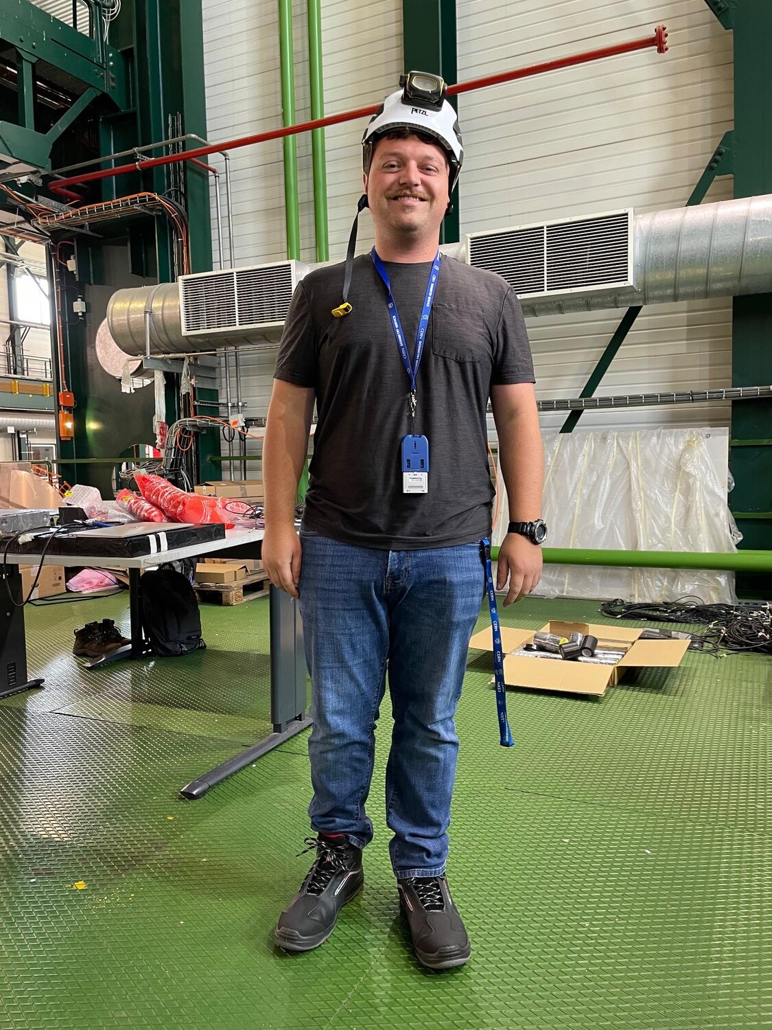 Joe Crowley wearing underground safety equipment while installing MilliQan hardware at CERN