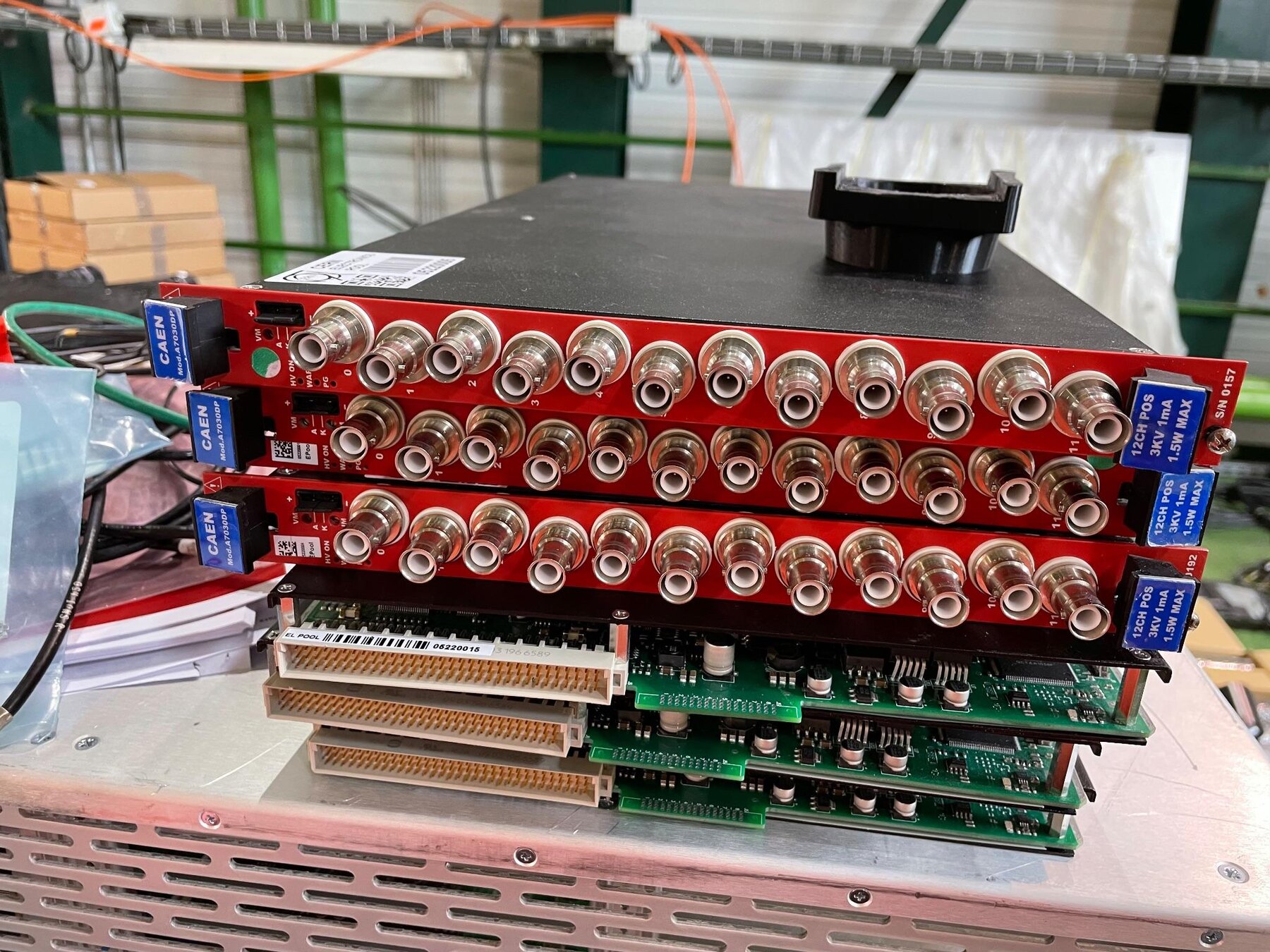 Stack of CAEN high-voltage distribution boards prepared for detector assembly